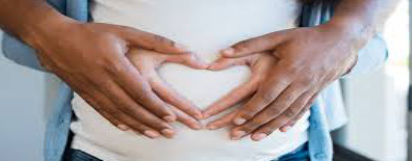 Hands on a pregnant woman's tummy